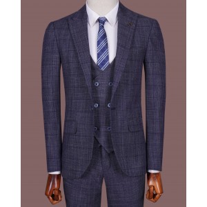 Modern youth classic three-piece suit in deep blue, Italian style, in a subtly noticeable checkered pattern.