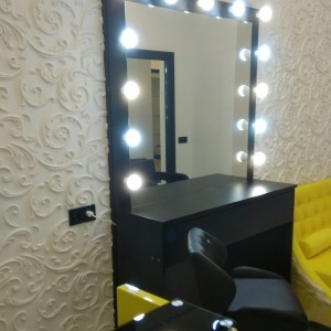 Make-up artist / hairdresser's workplace. Mirror with lights