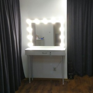 Makeup table with metal legs.